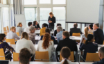 Woman teaching a room of adults